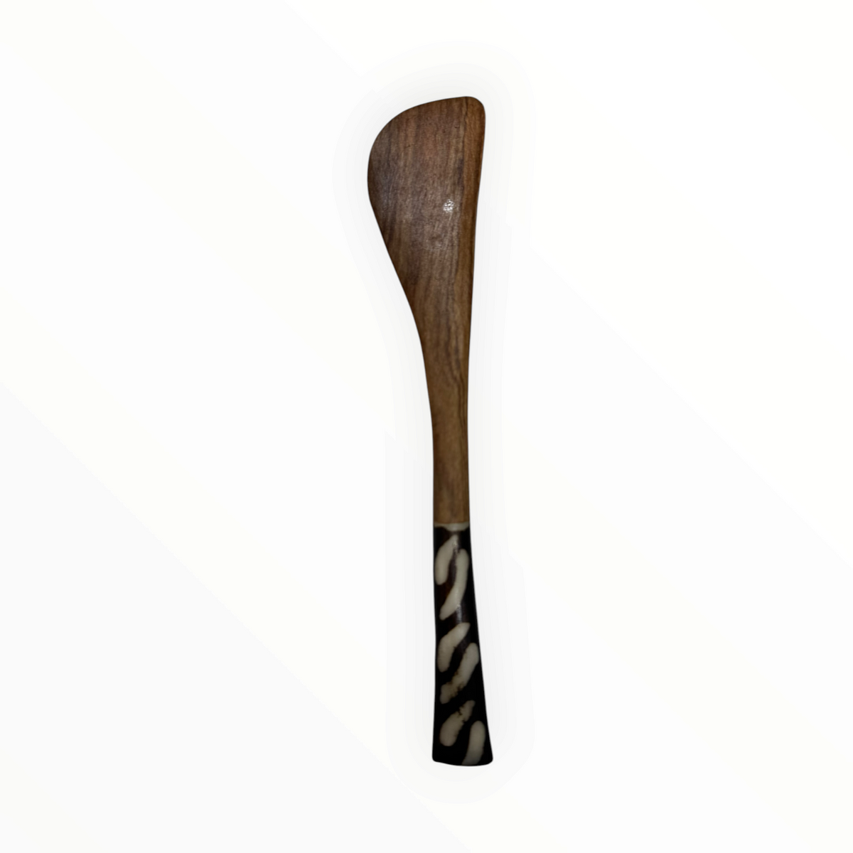 AFRICAGLAMOURART hand-carved wooden butter knife with a dark patterned handle and smooth curved blade.