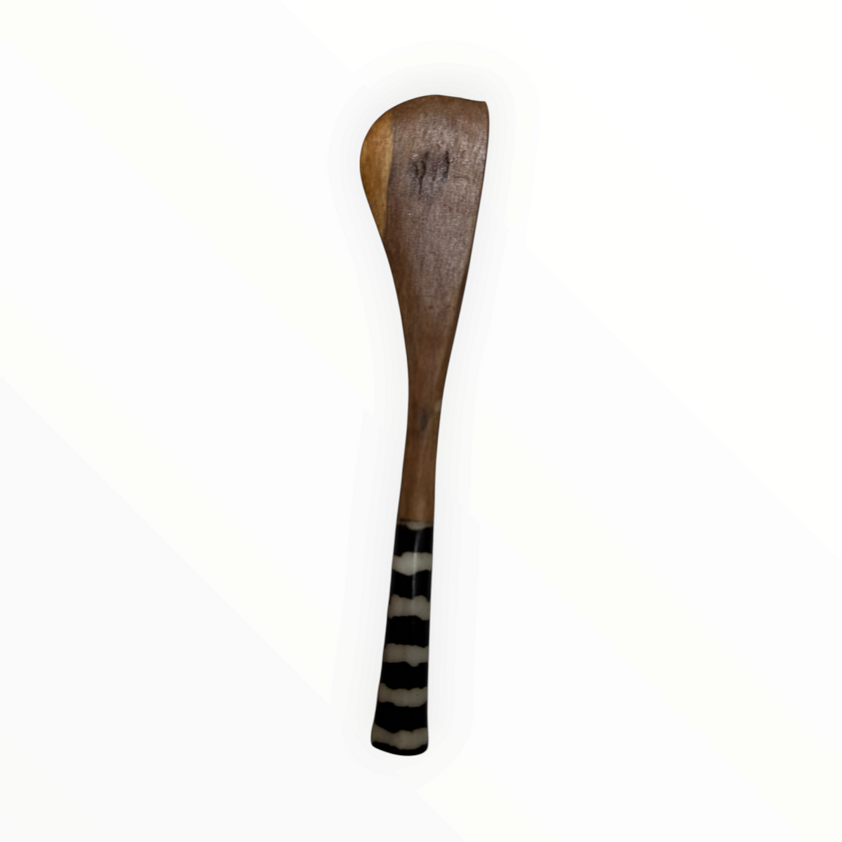 AFRICAGLAMOURART hand-carved wooden butter knife with a smooth blade and a decorative black and white striped handle.